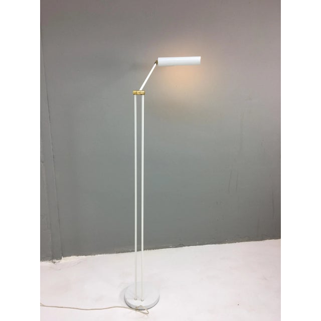 This floor lamp was designed by Koch & Lowy in 1976, and was produced by OMI during the 1970s .The piece comprises a white...