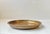 A solid bronze charger, dish or flat bowl with a reddish patina. Designed and manufactured by Tumulus Dania in Denmark...