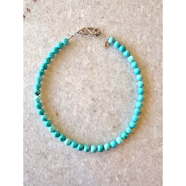 Turquoise Stone Beaded Necklace With Gold Tone Clasp. Designed by Matthew Izzo Size 8mm beads
