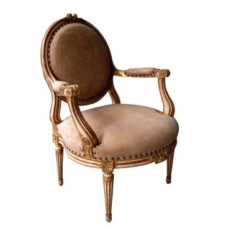 A Large-Scaled French Louis XVI Style Ivory Painted and Parcel Gilt Oval Back Open Armchair For Sale