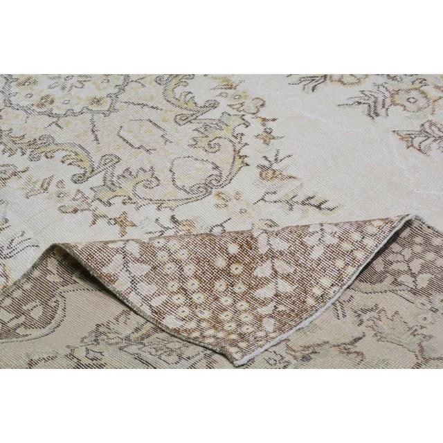 Hand-knotted with care using traditional rug-making techniques, this wool rug blends timeless craftsmanship with a modern...