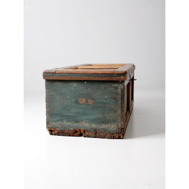 This exceptional antique blanket chest dates to the early 19th century and features a beautifully aged teal blue-green...