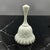 Crafted by the renowned Fenton Art Glass Company, this highly collectible bell features the intricate, raised "Spanish...