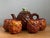 Celebrate the playful spirit of mid-century entertaining with this charming vintage ceramic pineapple teapot and four mugs...