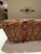 Antique rustic French kindling basket with metal strapping. It is sturdy and elegant in its simplicity