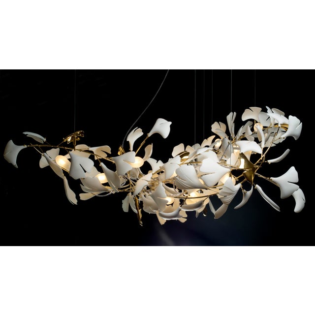 Characterized by flowing lines, soft shapes, Freely arranged Handmade translucent porcelain leaves in a complete...