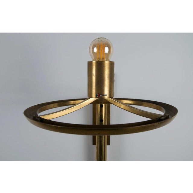 Italian wall lamp by arteluce from the 1970s, featuring a large hemispherical shade made of milky white perspex, supported...