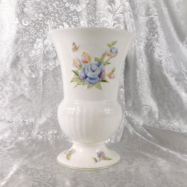 This is a footed white floral bone china vase by John Aynsley and Sons in the Celeste pattern. Aynsley has two Celeste...