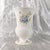 This is a footed white floral bone china vase by John Aynsley and Sons in the Celeste pattern. Aynsley has two Celeste...