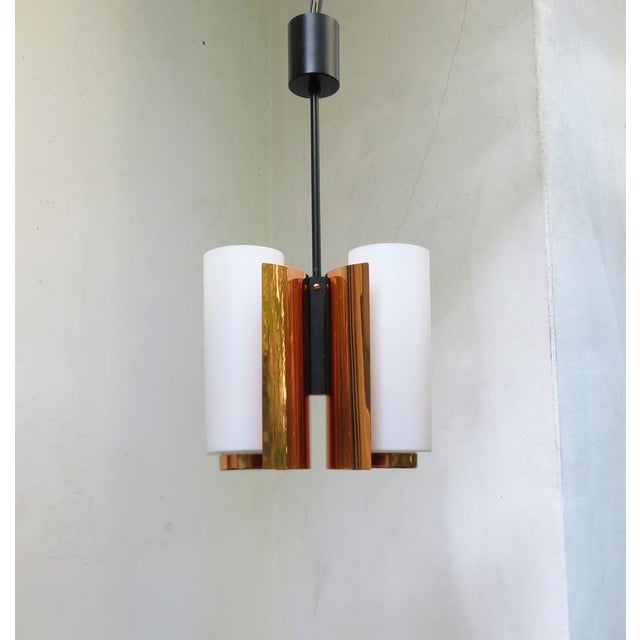 A few elegant and at the same time rare ceiling lights, made by Cosack in the 1960s. The lamps impress with the noble...