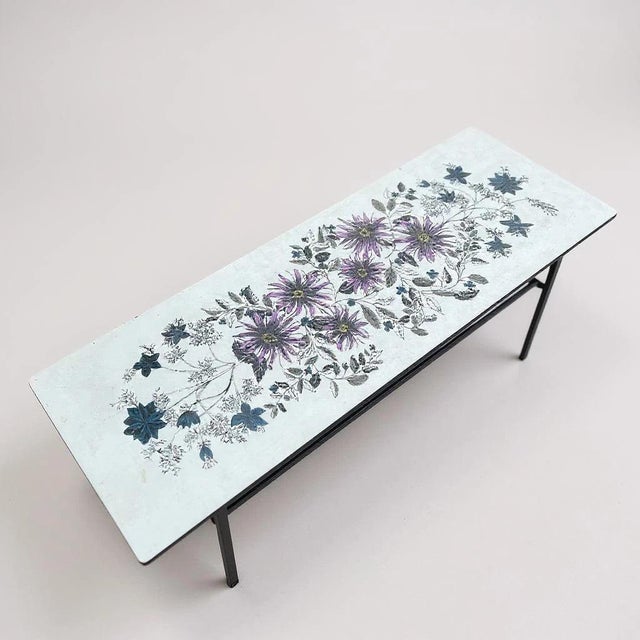 A striking original 1960s coffee table featuring the iconic floral design by John Piper, created for Habitat during...