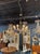 The Modernist Gold Murano Glass and Brass 8 Light Chandelier is a stylish and unique ceiling fixture that adds a touch of...