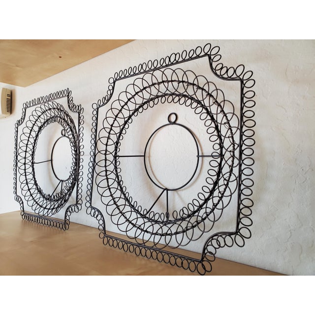 Meant to hold plates, these rustic wire frames are interesting enough to be hung as is. They have a very romantic/rustic...