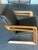 It is made of American walnut and Elmo leather. It reimagines the original 1953 Kem Webber “airline chair” that Walt...