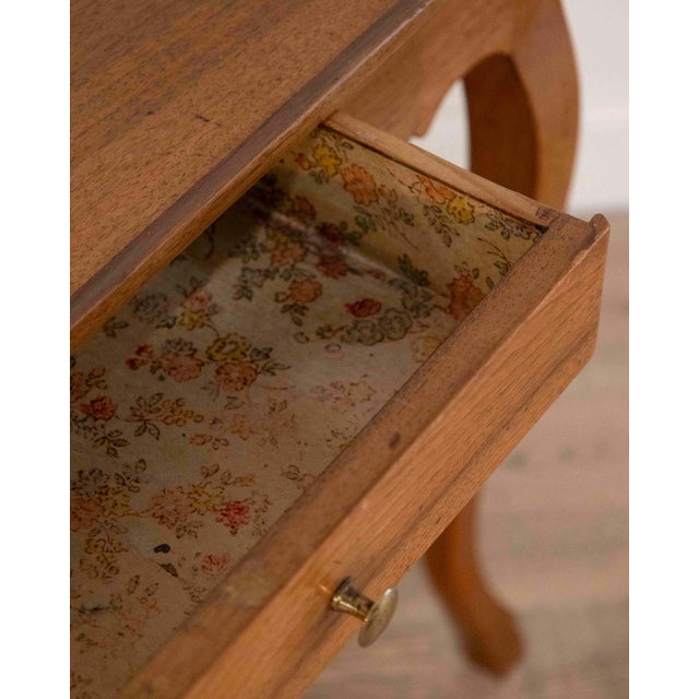 An authentic late 18th-century French cabaret table crafted in solid walnut. This refined and utilitarian form is...