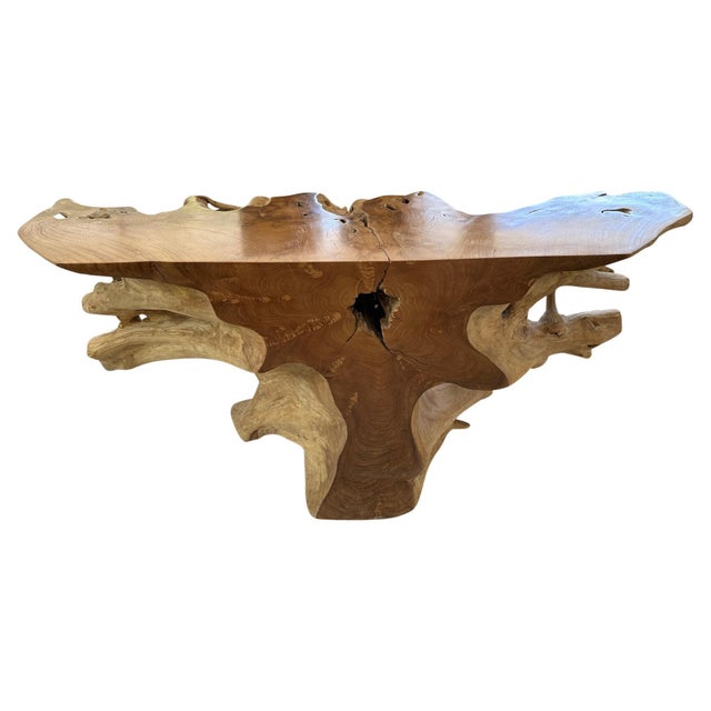 Stunningly beautiful sculptural console table hand carved from a single teak root. The flat surfaces have been polished...