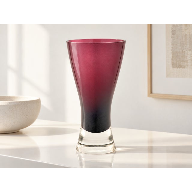 Elegant glass vase, model 1369 "Flindell," designed by Tamara Aladin for Riihimäen Lasi in Finland. The harmonious color...