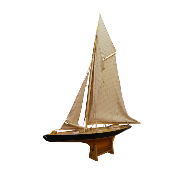 Large vintage model sailboat featuring Columbia, the America's Cup winning yacht. This ship model is built plank-on-frame...