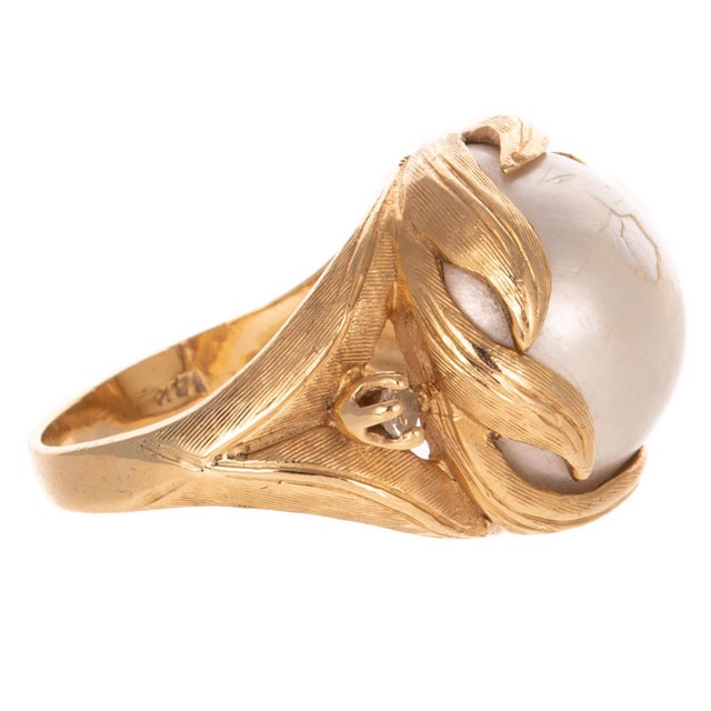 Vintage Kabra 14K Gold Mabè Pearl and Diamond Cocktail Ring. Ring features a Mabè Pearl approx. 16 mm in diameter. Mabè...