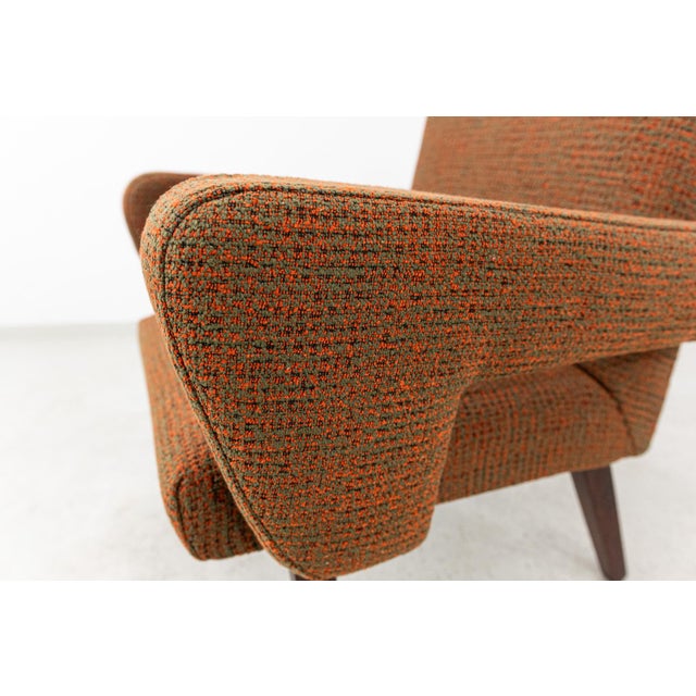 The armchair was manufactured in Czechoslovakia by the Jitona factory in the 1960s It features a compact, geometric form...