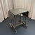 This industrial typewriter stand circa the 1940s showcases machine-age engineering with it's steel construction and...