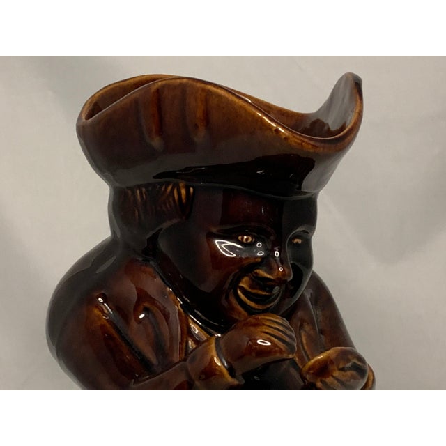 19th Century Rockingham Treacle Glazed Yellowware "Snuff Taker" Toby Jug for your consideration. The jug measures approx....