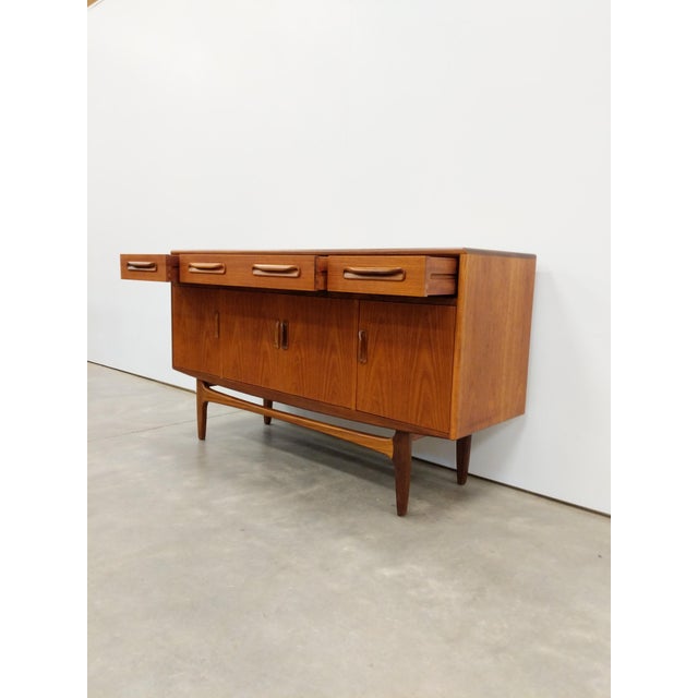 Authentic vintage mid century modern teak credenza / sideboard / console. "Fresco" series designed by Victor B Wilkins for...