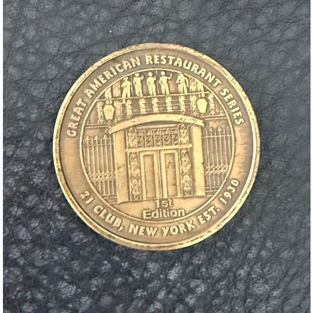 A wonderful piece of New York dining history — a 1st Edition bronze commemorative medallion from the "Great American...