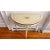 A French country-style hand-painted demilune console table. It has a rustic appearance to it which gives it an old-world...