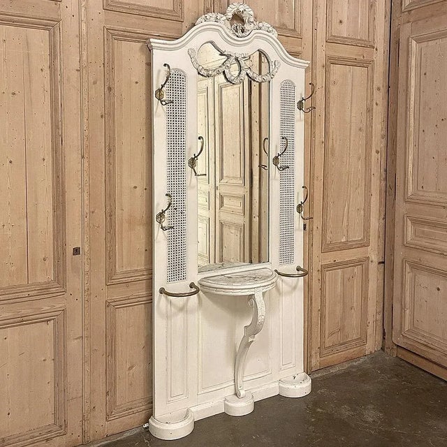19th Century French Louis XVI Painted Hall Tree is a majestic example of the neoclassical revival from the end of the...