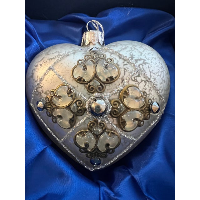 Sorelle Hand Crafted Glass Heart Ornament. Glitter and Metal Accents with original box. This heart-shaped ornament is...