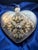 Sorelle Hand Crafted Glass Heart Ornament. Glitter and Metal Accents with original box. This heart-shaped ornament is...