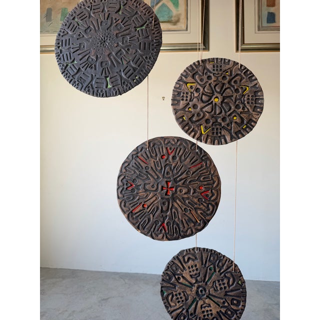 Striking 1980’s Mid-Century Modern pottery wind chime featuring a series of sculptural, hand-formed ceramic discs...