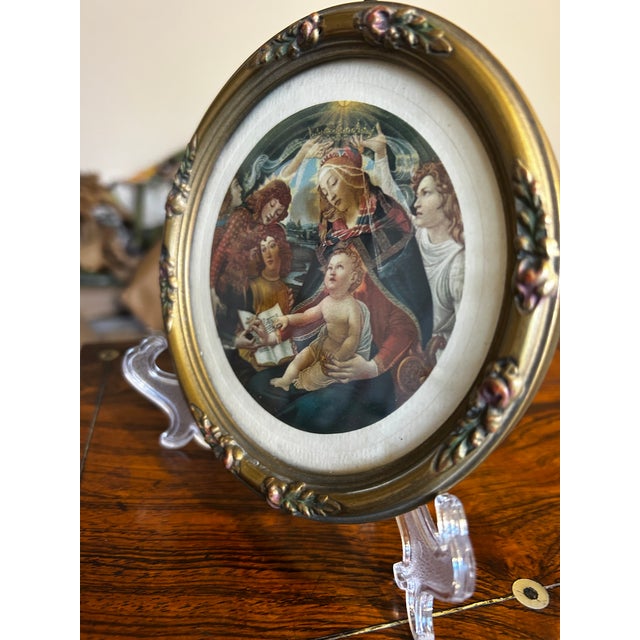 Small framed reproduction print of Botticelli's Madonna of the Magnificat in a vintage gilded frame. Round, 5 1/2". Print...