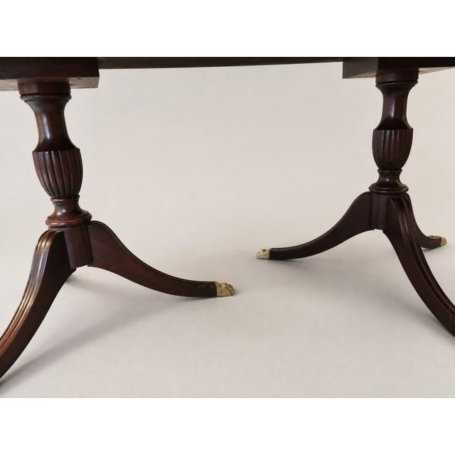 This is a Henkel Harris Model No. 2207 double pedestal dining table in genuine mahogany, handcrafted in Winchester,...