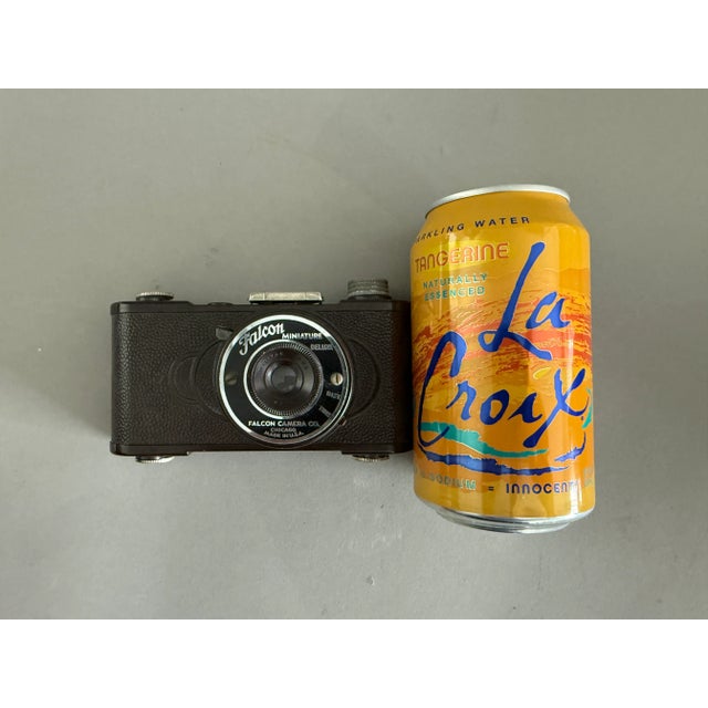 This Falcon miniature camera was made in Chicago of Brown Bakelite. It’s got great art deco lines and looks stylish on a...