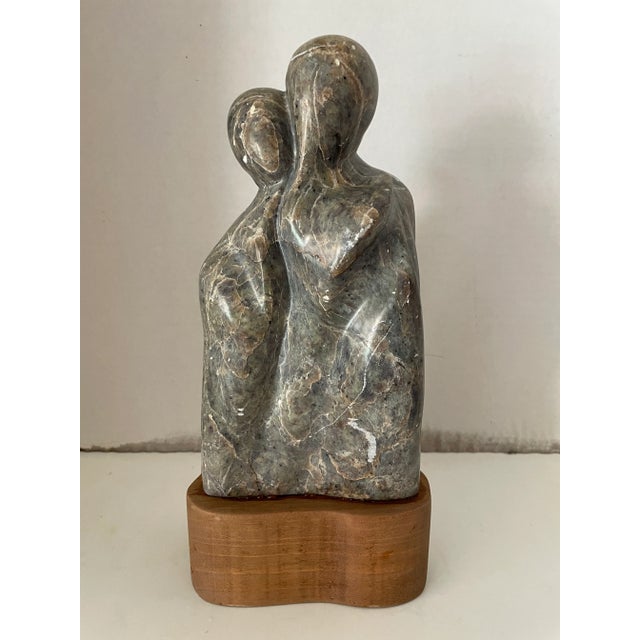 Vintage granite stone figural sculpture by EJC 1985. This green granite sculpture features a loving couple. The sculpture...