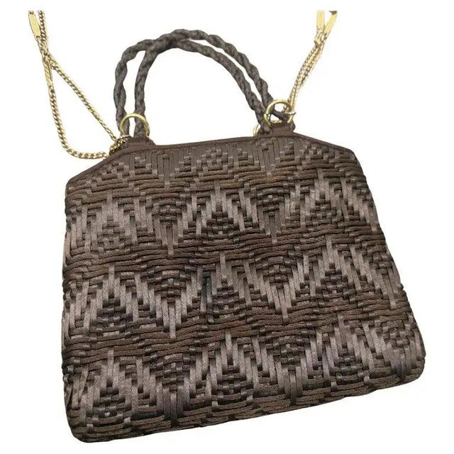 This exquisite 1960s Italian evening bag is a masterclass in mid-century texture and sophisticated design. The exterior...