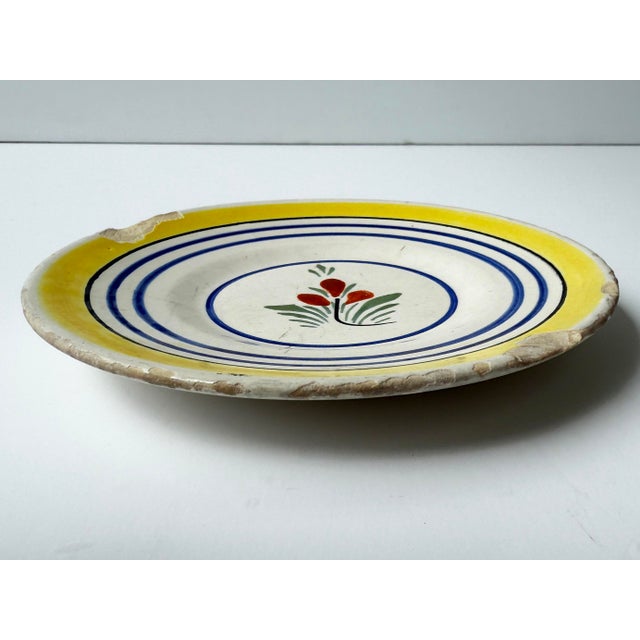 Antique plate with hand painted flower. Marked "Henriot Quimper France 729 B"