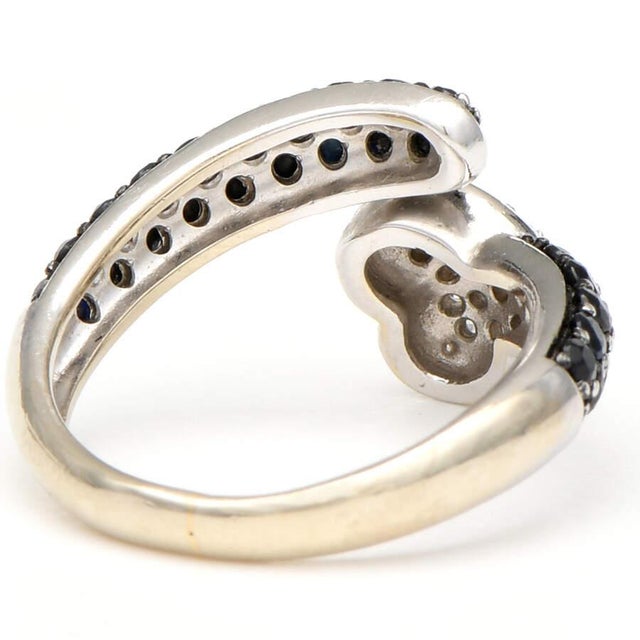 This ring features black sapphire, offering a most distinct look. You'll easily catch attention with the pave diamond...