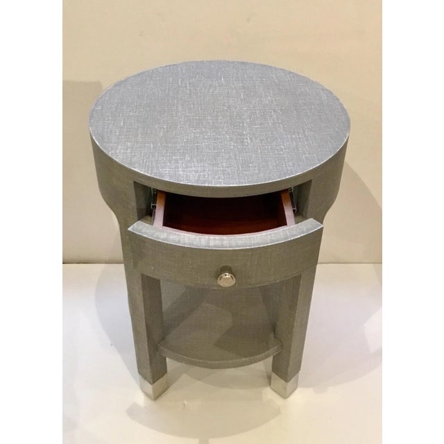 Stylish modern Gray Linen Style side table, one drawer with nickel pull, bottom shelf, nickel furrules, showroom floor...