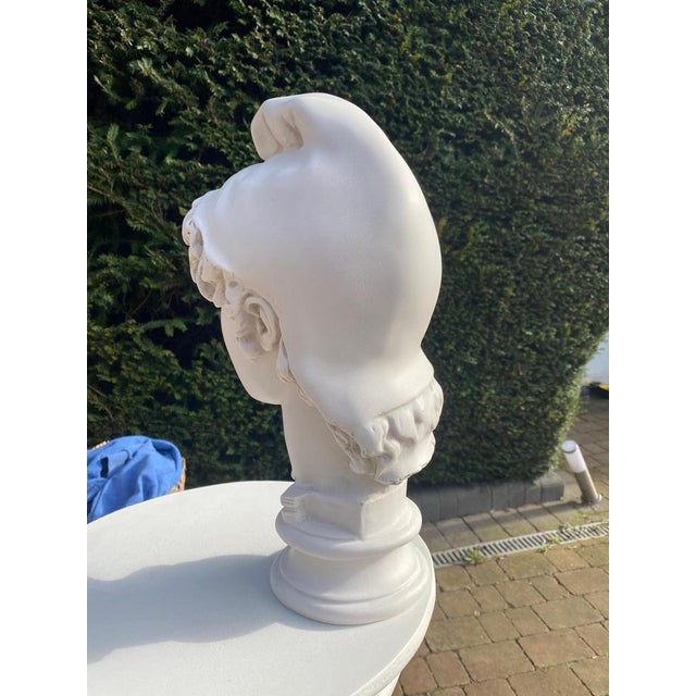 This 20th-century sculpture, titled "Head of Paris," is a refined interpretation of the classical depiction of Paris, the...