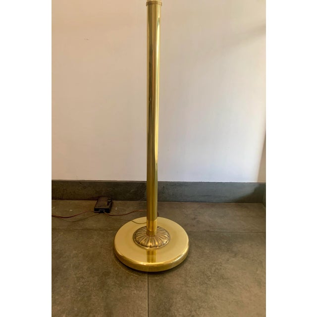 Vintage, solid brass torchiere with a marbled shade and dimmer. The light of the torchiere gives a beautiful, upward...