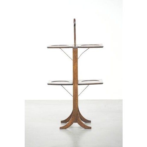 Charming English side table/cake stand made of oak from the late 19th/early 20th century. This charming and practical...