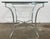 Vintage square Maison Jansen style brushed steel glass top table with brass hoofed feet. Elegant Neoclassical design...