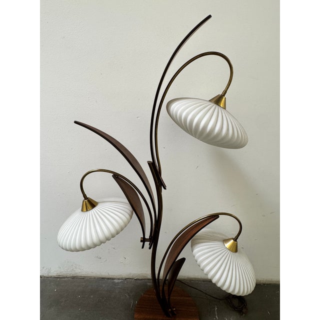 Design Era: Designed in the 1950s-1960s, reflecting iconic Mid Century Modern aesthetics.Key Features: It includes a four-...