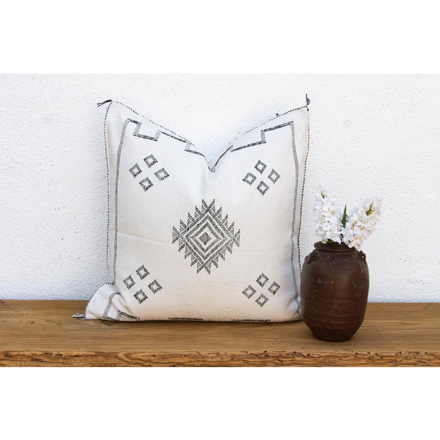 Make a graphic statement with this handcrafted Moroccan cactus silk pillow, measuring approximately 24 inches square....