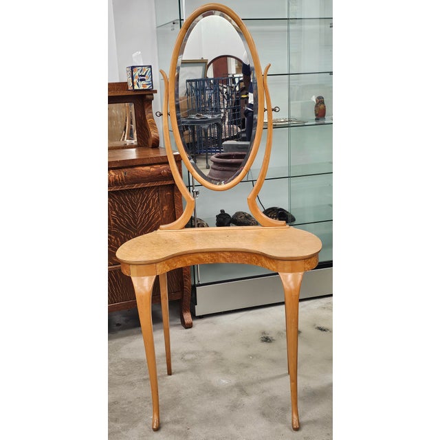 Edwardian Birdseye Maple Vanity with Mirror and a matching Side Chair Measures 31.5" in width x 18.5" in depth x 63" in...