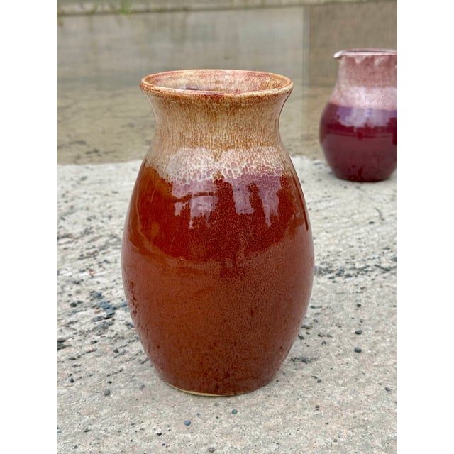 This hand-thrown ceramic vase captivates with its traditional form, meticulous craftsmanship, and experimental glazing...