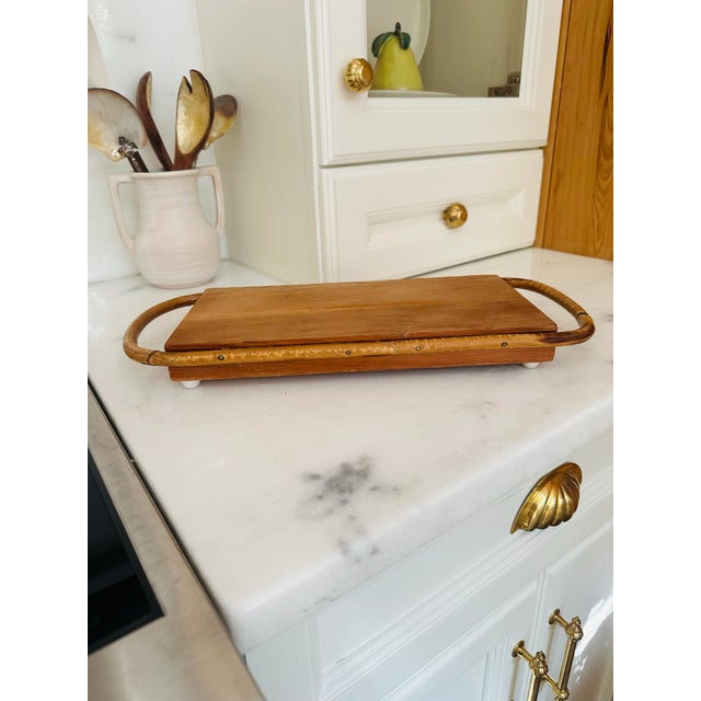 A vintage Rubel & Co. bentwood serving tray crafted from warm-toned pine with gracefully curved rattan-style handles....